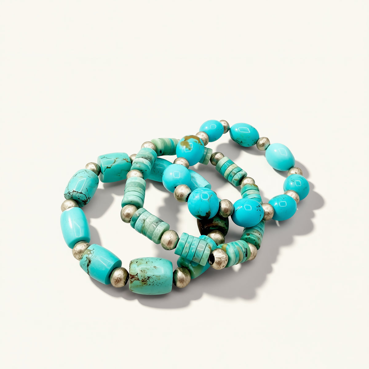 Turquoise beaded bracelets on a white background