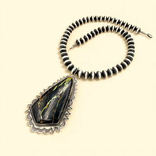 Black stone necklace with Navajo Pearls on a beige background