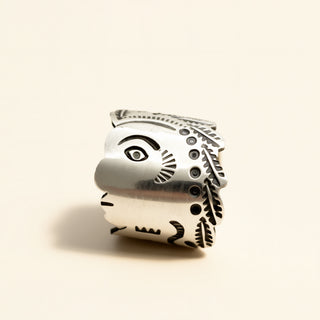 Silver ring on a beige background