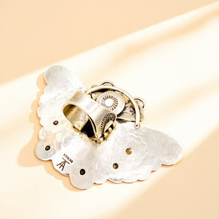 Silver ring shank on a beige background