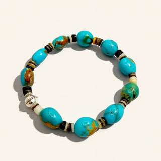 turquoise beaded bracelet on a beige background