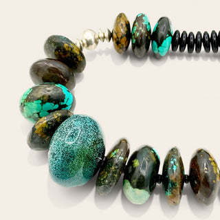 Necklace with multicolored beads on a white background