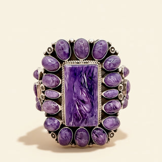 Purple stone cuff with a central rectangular stone on a beige background