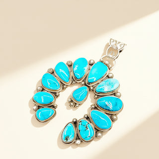 Blue naja pendant on a beige background