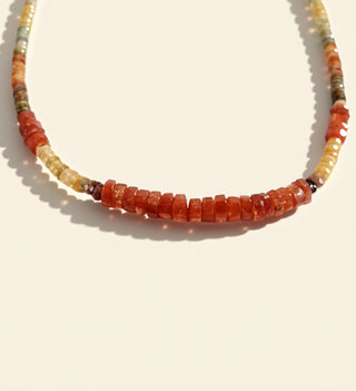 orange beads on a beige background