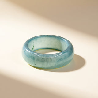 Turquoise band on a beige background
