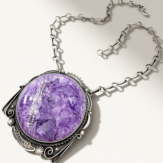 Purple stone necklace on a beige background
