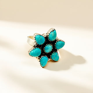 Flower turquoise ring on a beige background