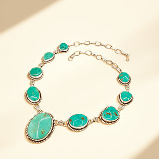 Necklace with turquoise stones on a beige background