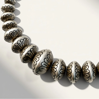 Necklace with decorative beads on a light background