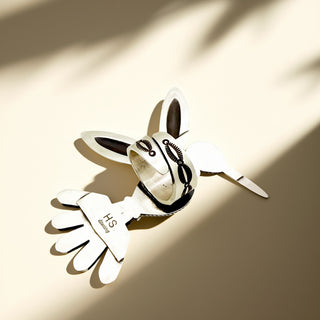 Silver ring shank with stamp on a beige background