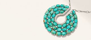 Turquoise beaded necklace on a white background