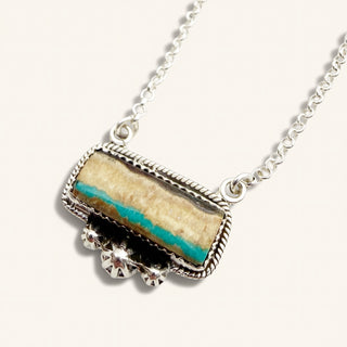 Necklace with a rectangular pendant featuring a natural stone design on a white background