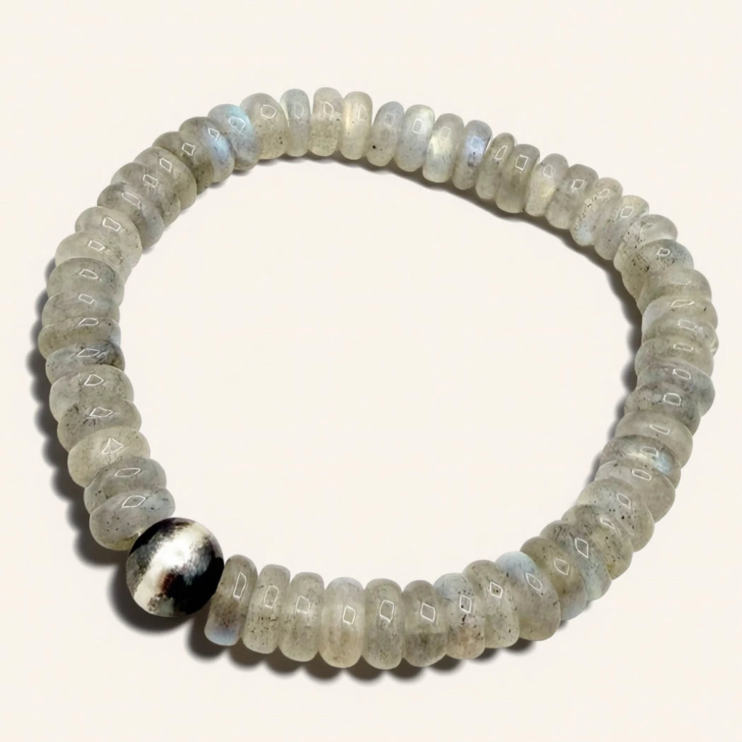 Beaded bracelet with a silver accent on a white background