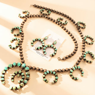 Necklace with turquoise and brown beads on a beige background