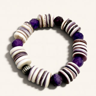 Bracelet with purple and white beads on a light background
