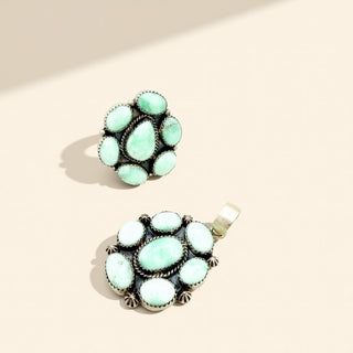 Jewelry pair with turquoise stones on a beige background