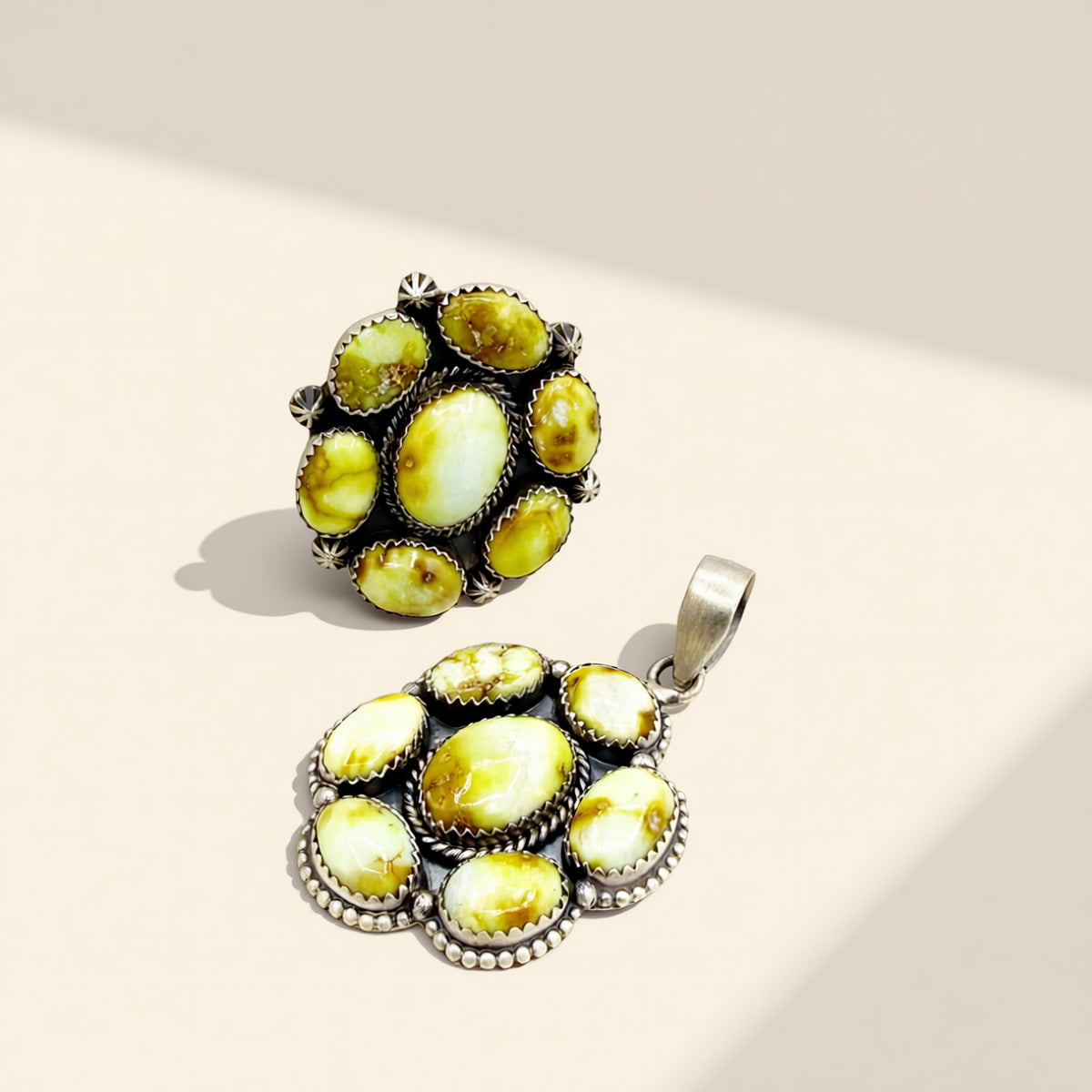 Two yellow stone jewelry on a beige background