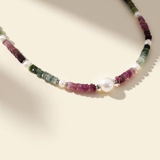 Necklace with multicolored beads on a beige background