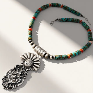 Necklace with colorful beads and a large silver pendant on a light background