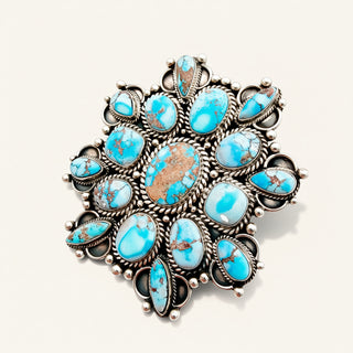 turquoise cluster ring on a beige background