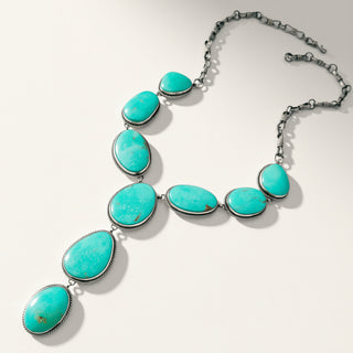 turquoise stone necklace on a beige background