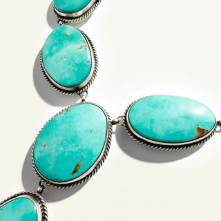 turquoise jewelry on a beige background