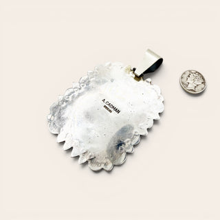 Decorative metal wall art with 'A. Cadman' branding on a light background