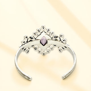 Silver cuff on a beige background