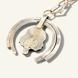 Silver jewelry on a beige background