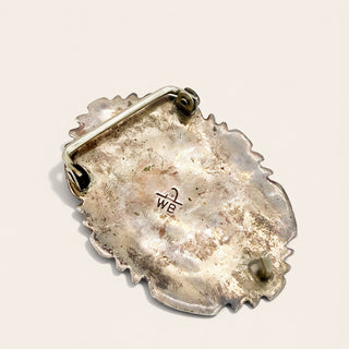 Silver Belt Buckle on a beige background